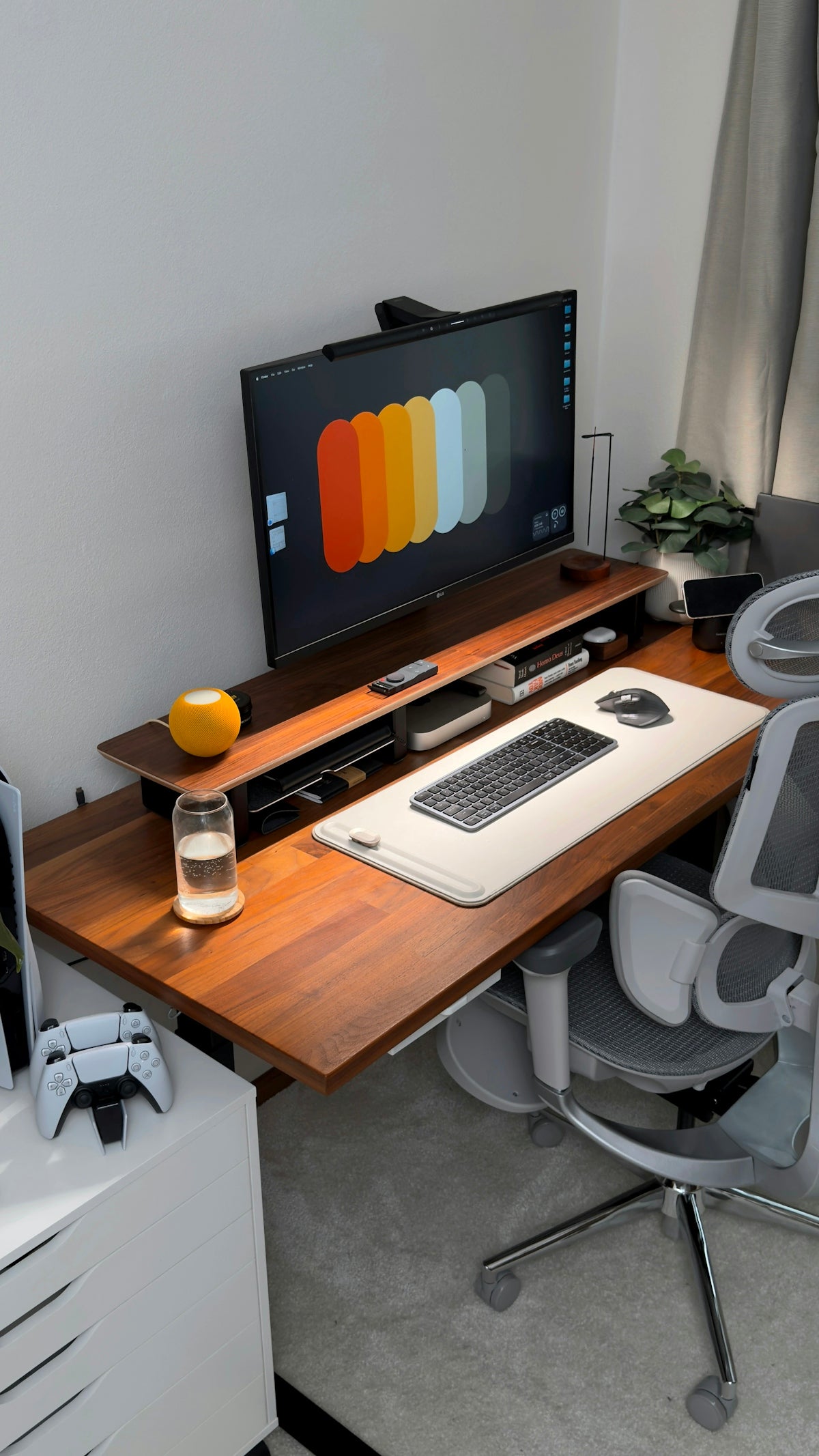 A modern desk setup with computer and gaming accessories.