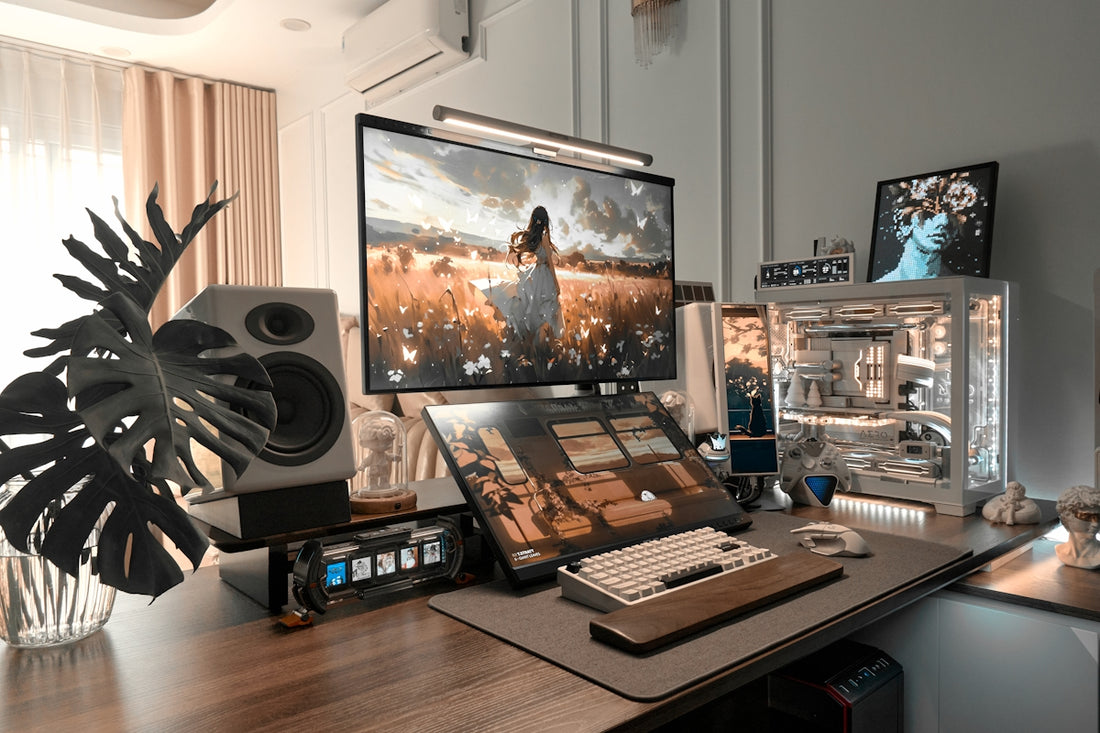 Modern desk setup with multiple screens, custom pc, and plant.